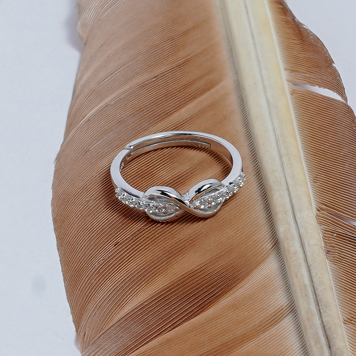 UP-LAYERING INFINITY SILVER RING